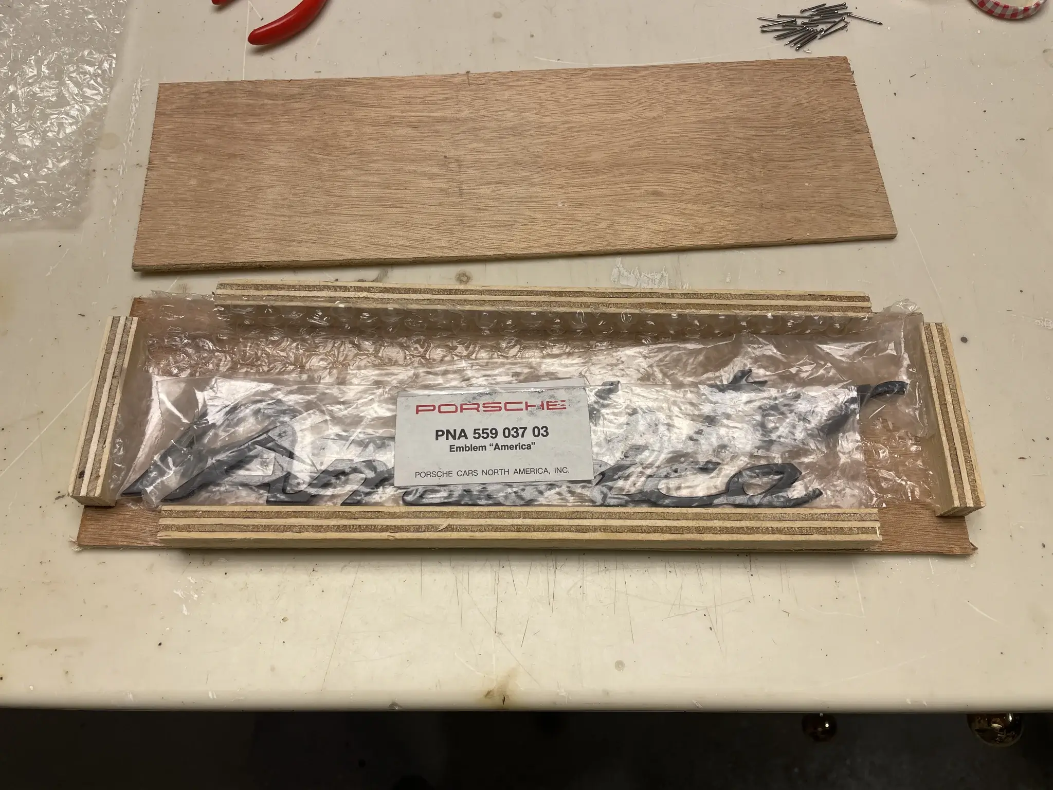 New Old Stock Porsche 964 America Roadster Emblems | PCARMARKET